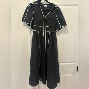 Elegant Black Dress with White Trim